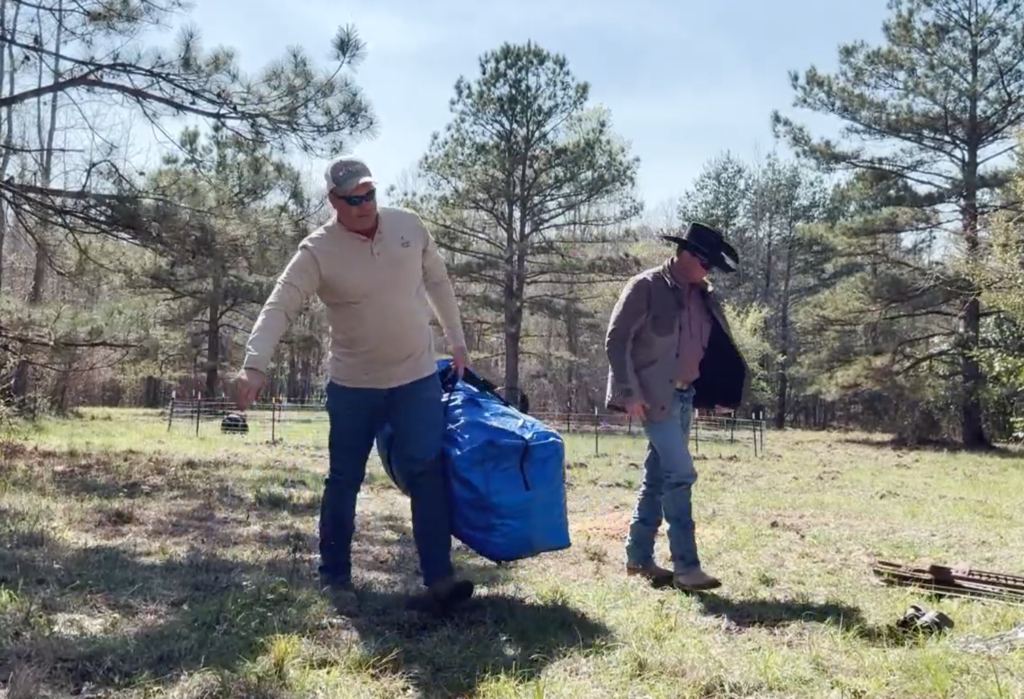 Carrying The P.I.G. Hog Trap in a compact transport bag for easy field deployment